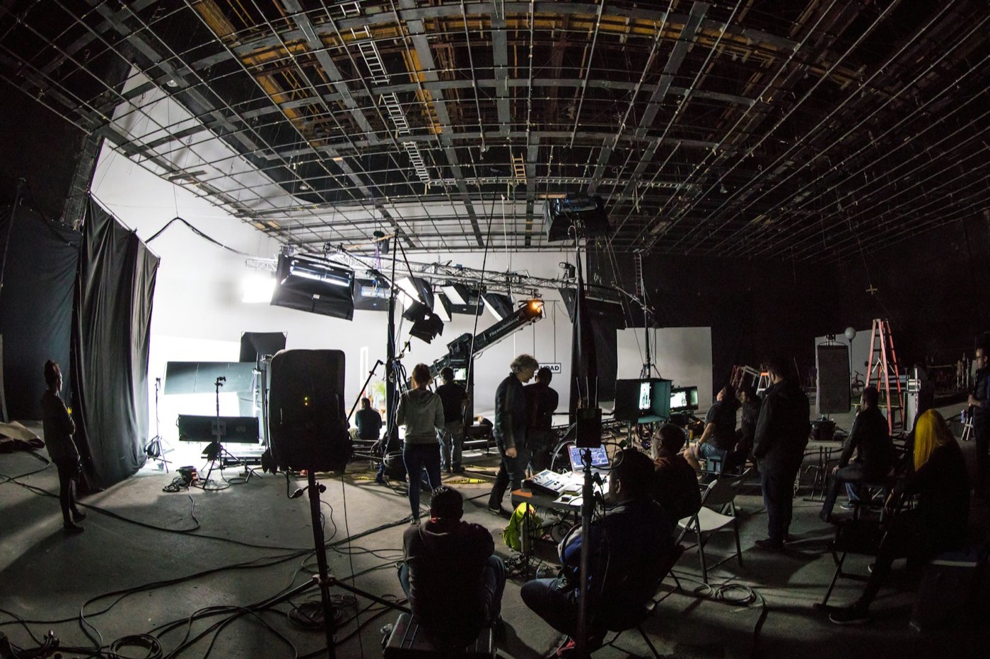 Film crew working on a large soundstage
